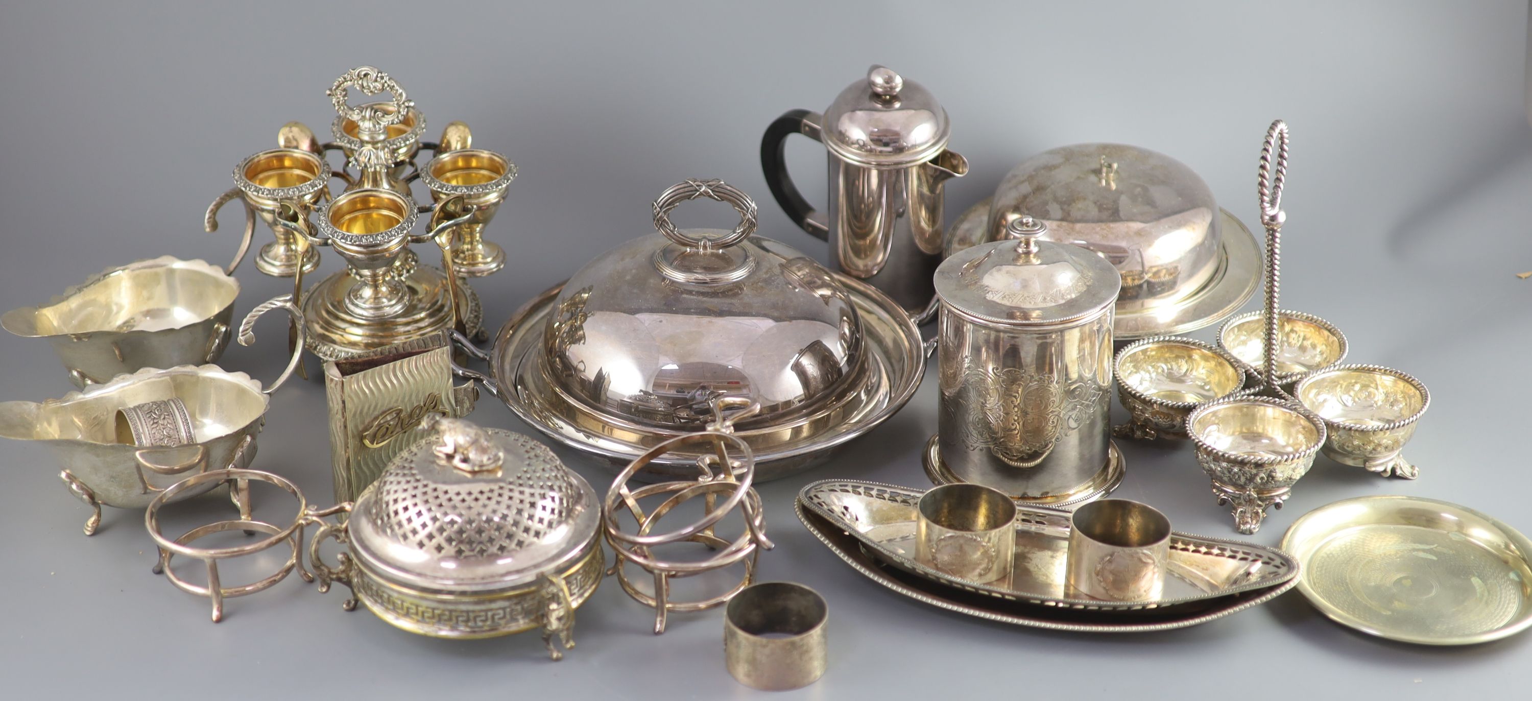 A silver plated egg cruet, a butter dish, a table salt and sundry other plated wares